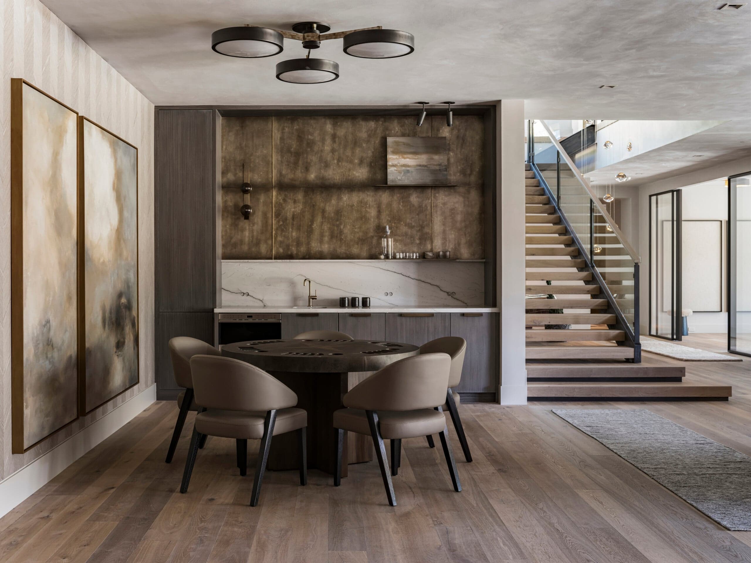 Wide-plank wood-look flooring in a modern mountain home — the kind of finish At Home Flooring installs across the western Chicago suburbs