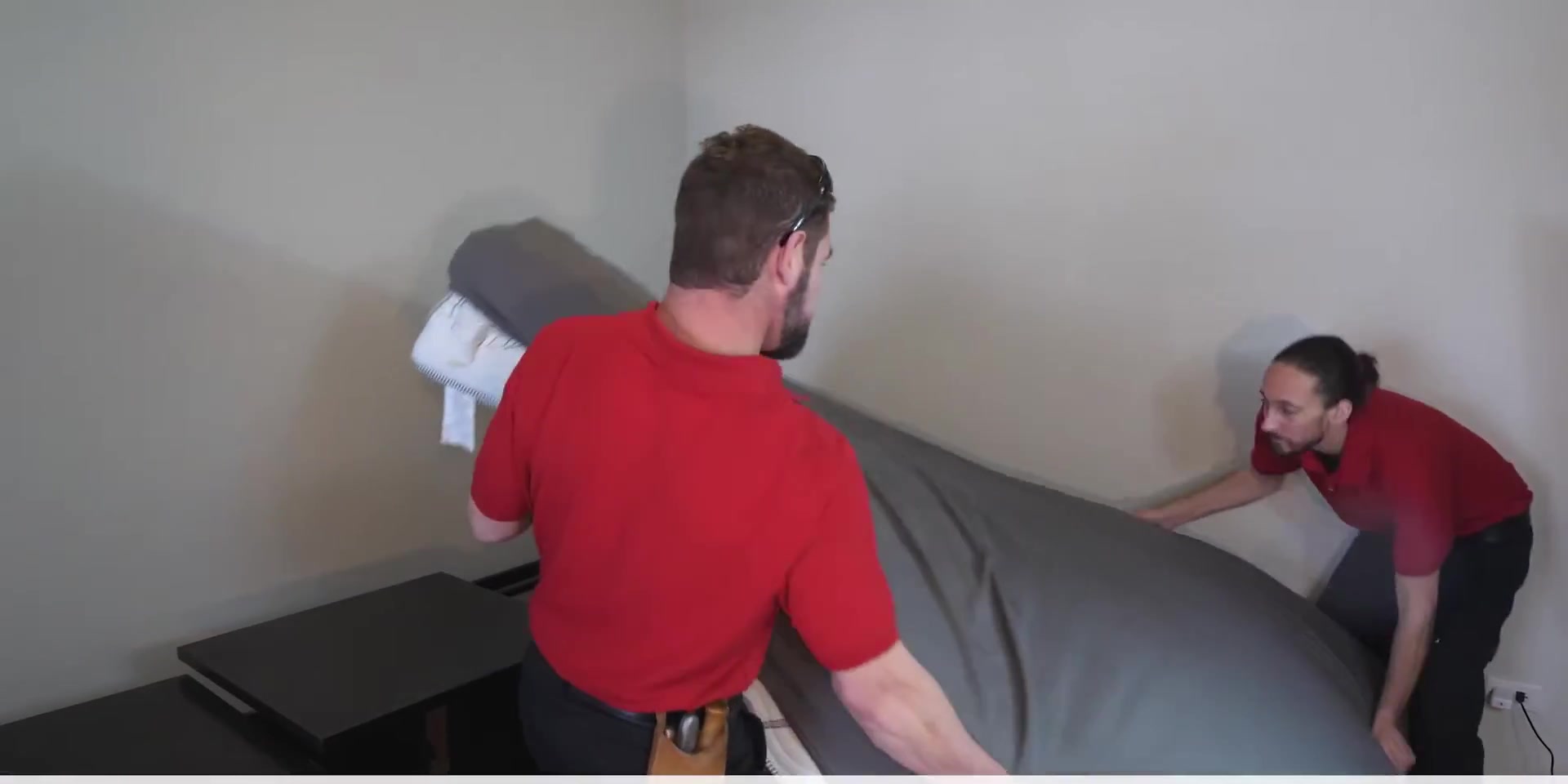 At Home Flooring crew moving furniture before a carpet install